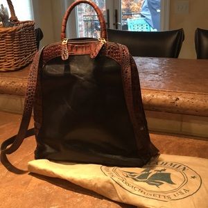 12”h x 12”l x 4”d 2 slip pockets, 1 zipper inside